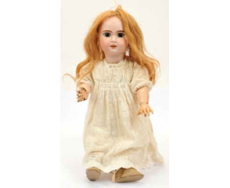 Jumeau Bebe bisque doll, French c.1907, impressed 1907 9, with open mouth, upper teeth, fixed brown paperweight eyes, pierced