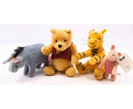 Steiff Winnie the Pooh and Friends including: (1) Winnie the Pooh, yellow tag 660474, mohair, 9.75"/25cm; (2) Eeyore, yellow 