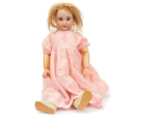 Jumeau Bebe bisque doll, French c.1907, impressed 1907 11, with open mouth, upper teeth, fixed blue paperweight eyes, pierced