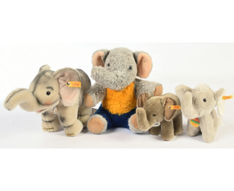Steiff four plush elephants: (1) Elfie Back in Time, yellow tag 064975, chest tag, swing label, 11"/28cm; (2) Trampili, yello
