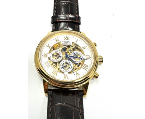 Rotary calendar gents gold tone skeleton movement automatic wristwatch 