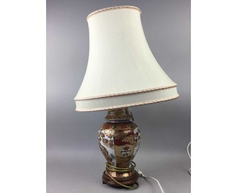 JAPANESE VASE LAMP,with figural decoration and cream shade, 70cm high