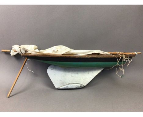 TWO POND YACHTS,along with other model boat hulls and accessoriesThe lengths of the decks are approximately , 53cm , 56cm , 2