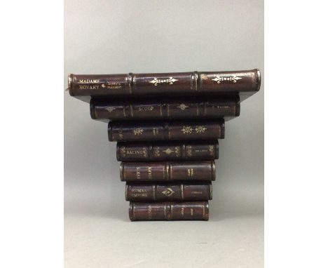 FAUX BOOKS WALL BRACKET,26cm high, 29cm wide, 21cm deep, along with a set of nine books by Dickens (10)