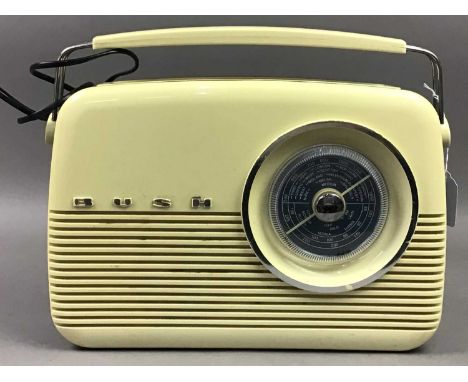 VINTAGE BUSH CREAM AND BLUE BAKELITE RADIO,34cm wide, along with a telephone, the dial commemorating the Silver Jubilee of Qu