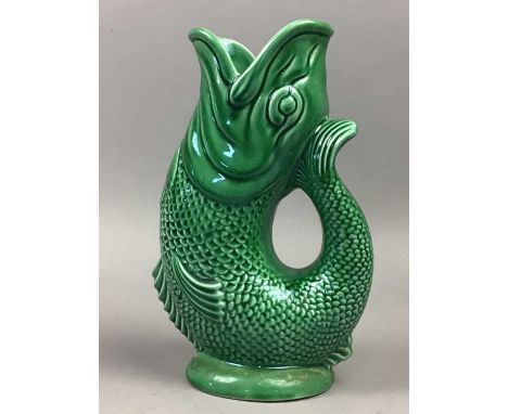 TWO DARTMOUTH OF DEVON CERAMIC FISH GURGLE JUGS,23.5cm high and 23cm high, bearing makers name underneath