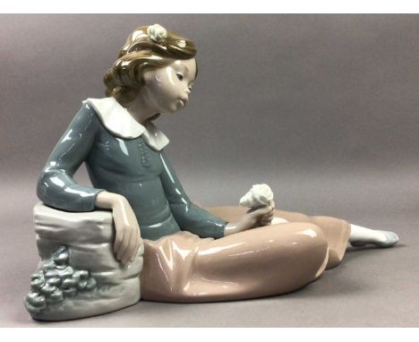 NAO FIGURE OF A SEATED GIRL,22cm high, along with eight other Nao and Royal Doulton figures (9)