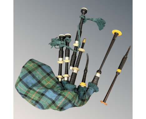 A set of Scottish ebonised, faux-ivory and nickel-mounted bagpipes, with African blackwood chanter by R G Lawrie (split runni