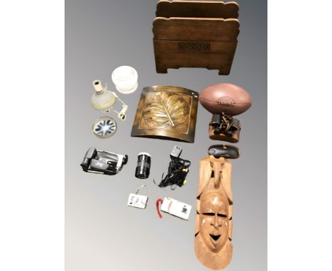 A carved oak magazine rack together with other treen items, table lamp, digital camcorder, pair of field glasses, rugby ball 