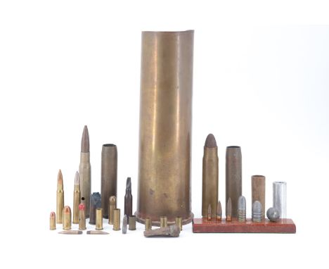 A 1942 6-pounder brass shell case together with two snap caps and a small group of inert small arms ammunition