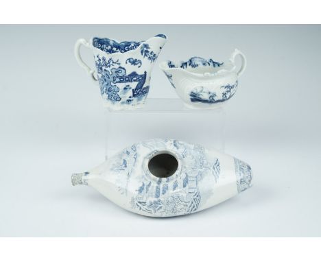 Two 18th Century Worcester moulded blue and white milk jugs, bearing underglaze crescent and calligraphic marks, together wit