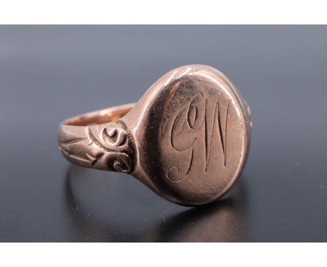 An early 20th Century 9 ct gold signet ring, having an oval face with engraved monogram, its shank engraved "From Betty, 1917