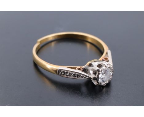 A diamond solitaire ring, comprising a brilliant cut stone of approx 0.2 ct crown set on an 18 ct yellow metal shank with dia