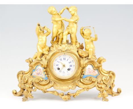 An early 19th Century gilt brass mantle clock by Raingo Frerre, Paris, having a drum movement striking on a bell, the rococo 