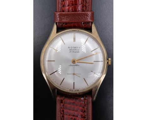 A 1960s Rotary Maximus 9 ct gold wristwatch, having a 21 jewel Swiss incabloc movement, a silvered dial with engraved baton m