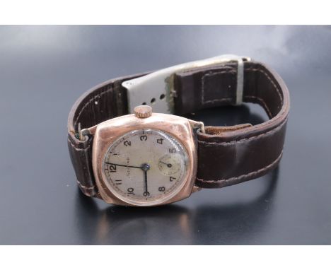 A 1940s Record 9 ct gold wristwatch, having a 15 jewel manual wind movement and circular frosted silver face with Arabic nume