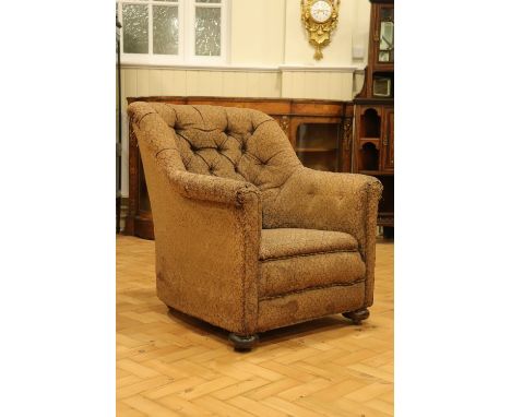 A late 19th / early 20th Century button-upholstered lounge armchair, 84 cm high x 82 cm wide