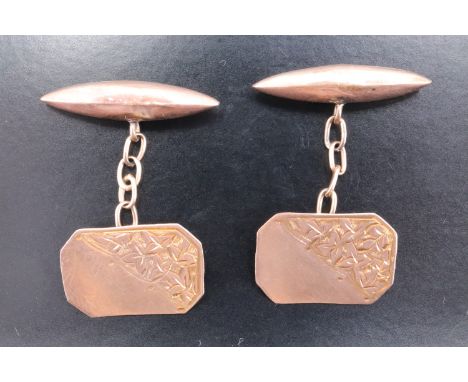 A pair of 9 ct gold cufflinks, having foliate-engraved canted oblong faces and "torpedo" backs, 2.5 g