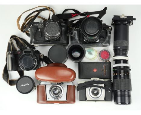 A Canon A-1 camera, Finepix S602 zoom camera, Agfa Silette camera, Kodak vest pocket camera model 3, Brownie 44B camera, Zeni