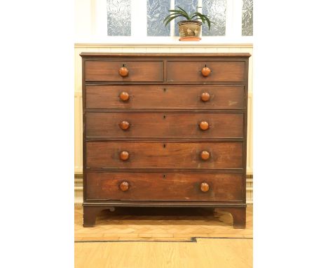 A George III mahogany chest of two short over four long cock-beaded drawers, having square bracket feet, 54 cm x 115 cm x 120