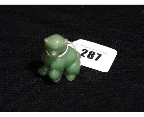 A Carved Green Jade Model Cat