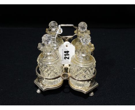 A Georgian Four Bottle Cruet Set Within A Silver Stand With Hallmarks For London 1805 And Makers Mark For R & S Hennell