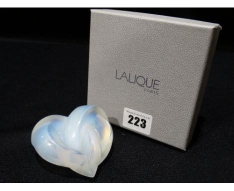 A Boxed Lalique Opal Glass Knotted Heart Desk Weight