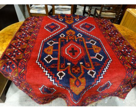 A Red Ground Woolen Carpet With Successive Borders