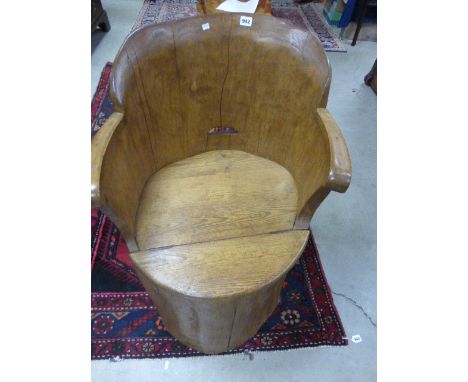 Rustic hollowed tree trunk chair with lid seat  