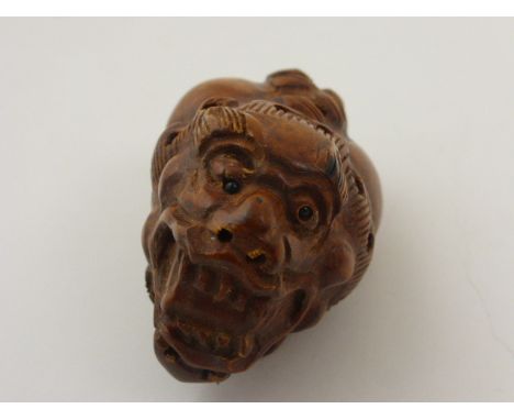 Signed wood netsuke of a dragon (double sided)
