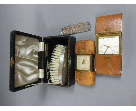 Cased Silver Backed Dressing Brush and Comb Set, another Comb in White Metal Case plus Two Vintage Europa Travelling Alarm Cl