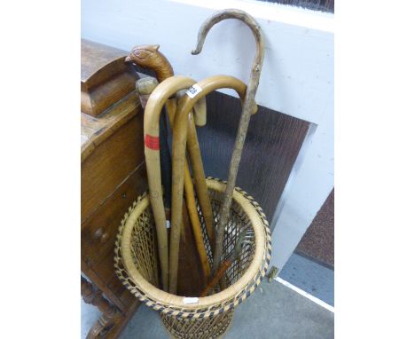 Wicker Stick Stand with Five Wooden Walking Stick and a Cricket Bat