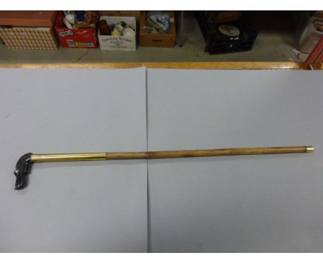 Bamboo shafted walking stick with black dogs head knop