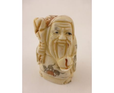 Signed oxbone netsuke of an old man traveller