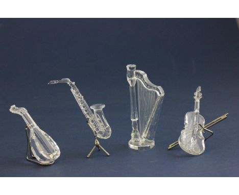 Set of Four Boxed Swarovski Silver Crystal Instruments including Saxophone 7477 000 007 / 211728 with certifciate, Harp 7477 