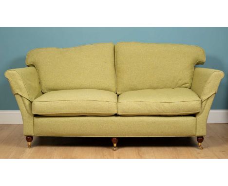 A green flecked sofa, mahogany, with squared mahogany back legs and ball rounded castor legs to the front, 194cm w x 90cm d x
