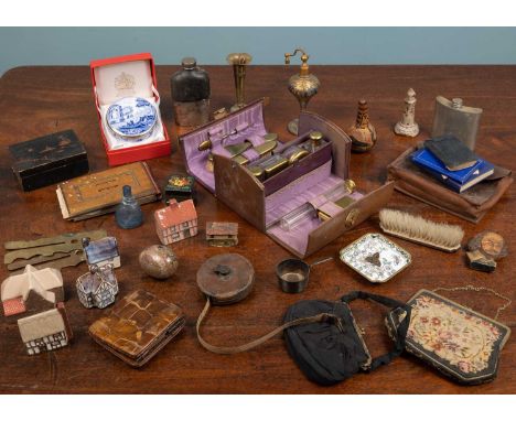 An antique leather ladies travelling case containing bottles, hairbrushes etc, each engraved 'Frances' together with further 
