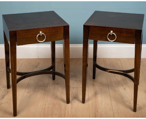 A pair of modern hardwood occasional bedside tables with silvered metal ring turned handles to the frieze drawers, all on squ