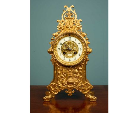 An ornate French gilt metal clock, with an enamel clockface, 35 x 19cmUsed condition