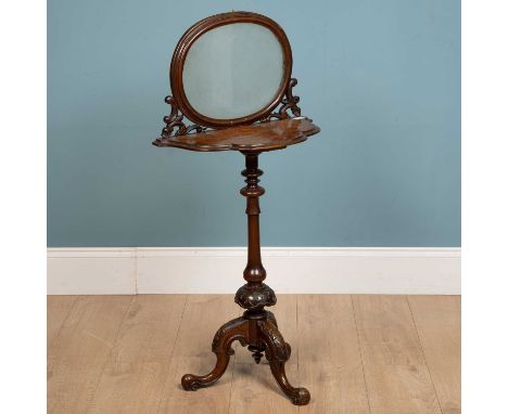 A Victorian walnut side table with etched glass raised back and serpentine front, with turned support and tripod base, 50cm w