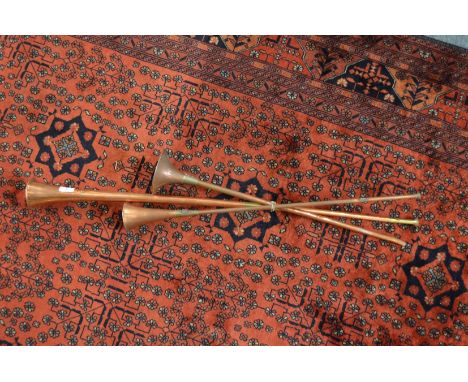 Three copper hunting horns.