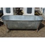 A large galvanised bath/planter.