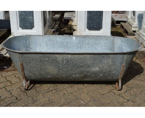 A large galvanised bath/planter.