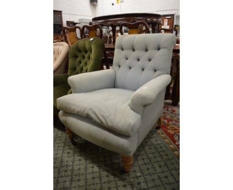 A Victorian button upholstered deep armchair.