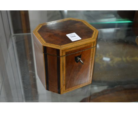 A Georgian design mahogany and satinwood banded tea caddy.