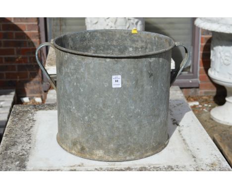 A galvanised twin handled planter.