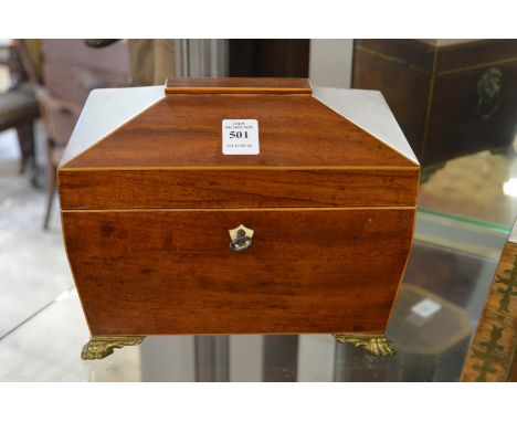 A mahogany sarcophagus shaped tea caddy.