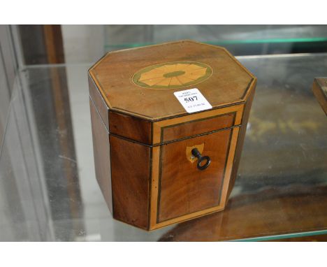 A Georgian style mahogany and satinwood tea caddy.