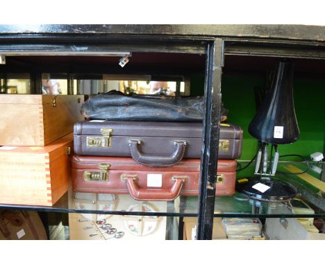 An angle poise lamp and other items.