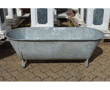 A large galvanised bath/planter.